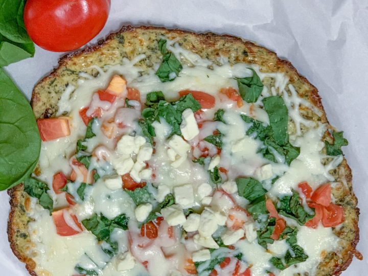 This cauliflower pizza crust is the best and you can top it with your favorite pizza ingredients for the tastiest low carb lunch or dinner option! #easy #recipe #low #carb #lowcarb #keto # healthy #vegan #vegetarian #how #to #make