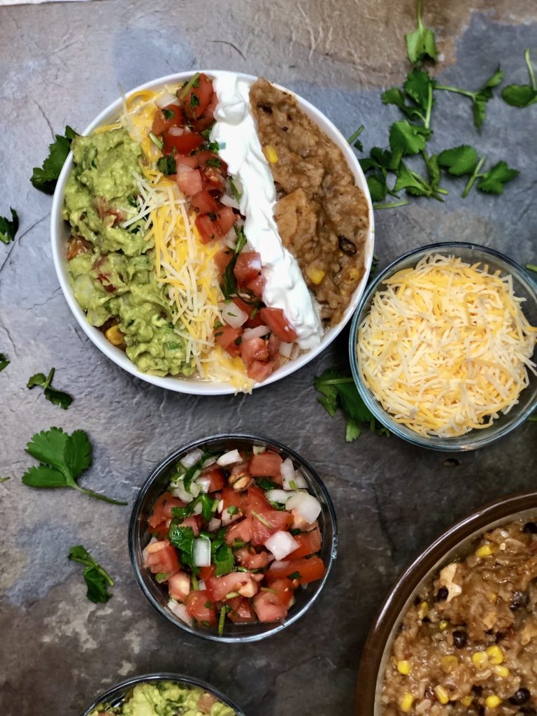 Today I are going to liven up your Taco Tuesday with this amazing Instant Pot Chicken Burrito Bowl. All the hearty goodness of a traditional burrito, but we eat it with a spoon! But the beauty, the beauty is you can take everything in this bowl, and put it in a tortilla shell and have the most delicious homemade burrito you have ever had.