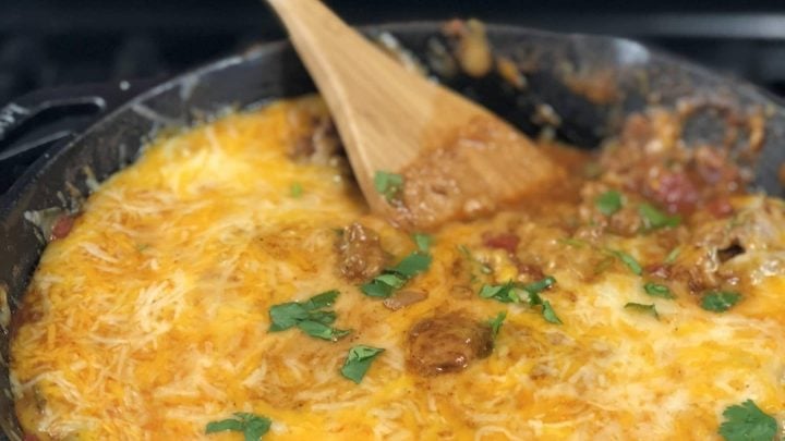 I came up with this Cheesy Ground Beef Keto Taco Skillet. This is a great recipe and topped with sour cream these keto tacos are amazing. Check out the nutritional information below, this low carb taco recipe is only 4 net grams of carbs per serving! #keto #lowcarb #cheesy #lchf