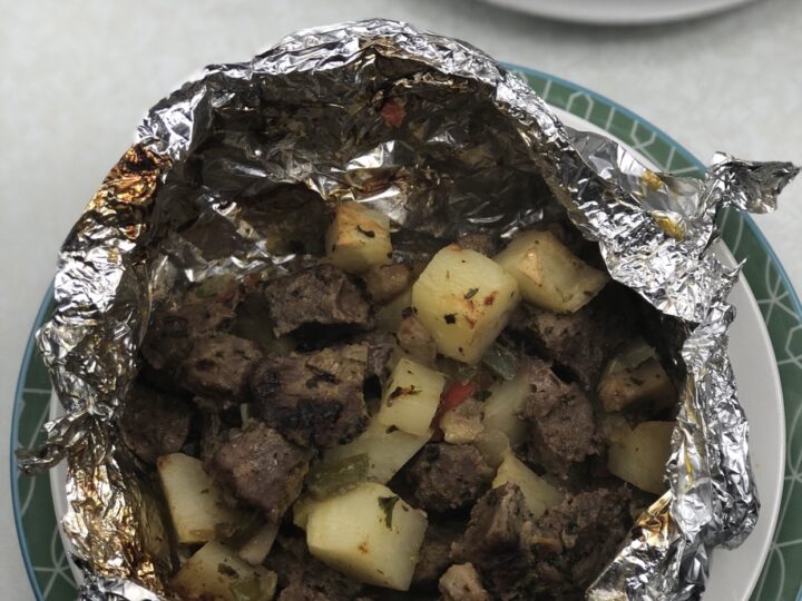 The Air Fryer Steak Hobo Dinner Recipe is an all-in-one recipe that is filled with juicy and flavorful steak, potatoes, peppers, mushrooms, and a handful of seasonings. You might have heard of a hobo dinner recipe that is more driven towards when you are out camping, toss everything in the foil packet, toss on the fire and let it cook. This steak hobo dinner I am sharing can be made in your Air Fryer and will give you those same rich and savory flavors just like cooking over a campfire. Steak and potatoes are two foods that just go together perfectly, and the Air Fryer steak turns out so juicy and flavorful.