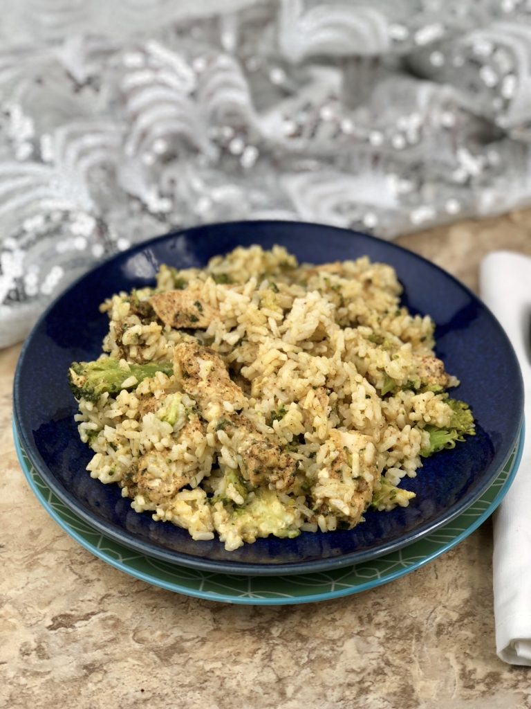 This creamy Creamy Air Fryer Chicken Broccoli Rice is a very simple recipe to make that creates a single serve dish. You create that all-in-one healthy dinner in foil packets that are rich in flavor and will leave your family feeling satisfied. #airfryer #chicken #creamy #chickenrice #broccolirice #rice #broccoli