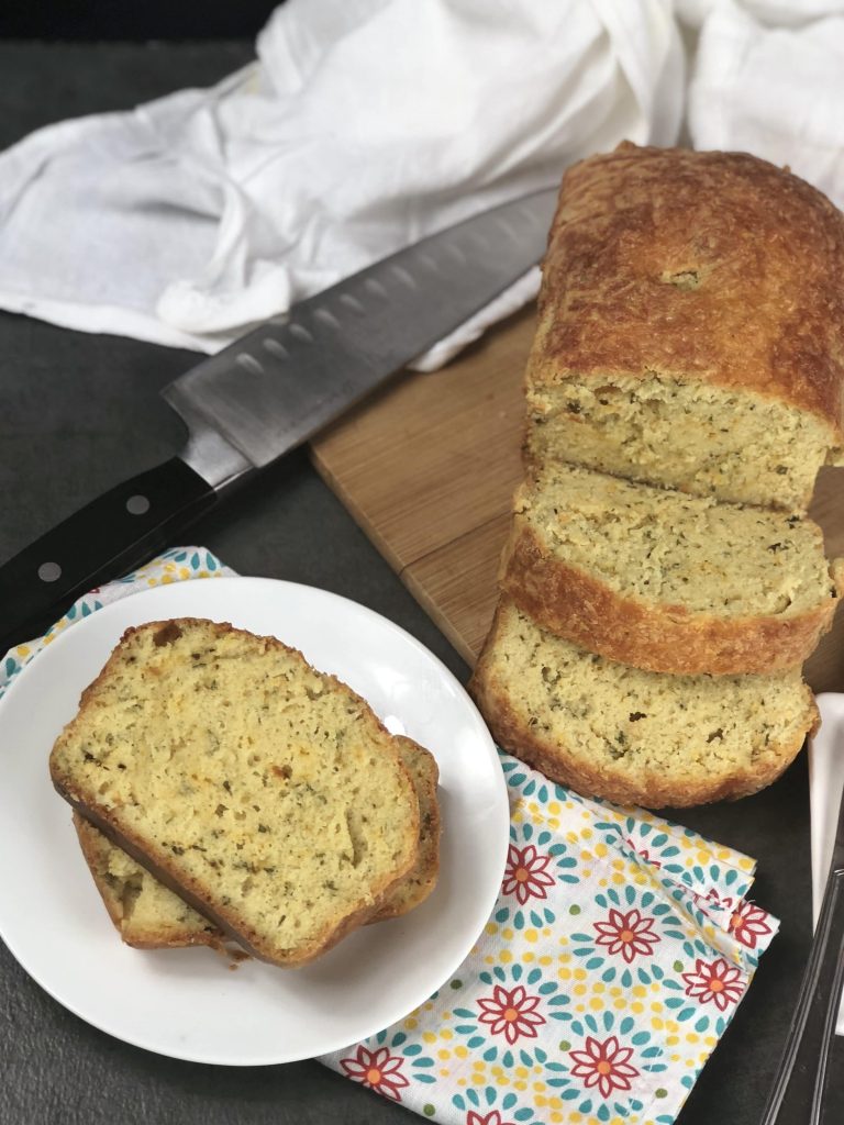 This cheddar garlic herb keto bread is a must make if you are following the keto diet. It is a keto bread that uses almond flour and a nice low carb bread to fill those cravings. #keto #lowcarb #ketobread #cheddargarlicherb