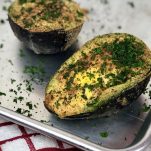 Air Fryer Baked Avocado Egg. Is what dreams are made of. A&nbsp;stuffed avocado filled with an egg and seasonings that make a perfectly healthy breakfast. And bonus, this avocado egg is low carb and keto! #lowcarb #keto #avocado #egg #airfryer