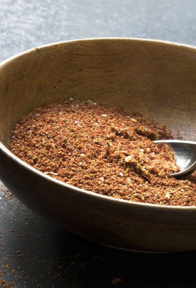 homemade old el paso taco seasoning in a wooden bowl with a spoon