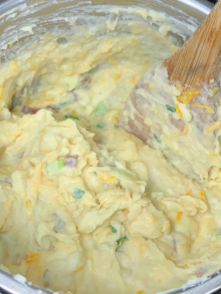 Close up of loaded mashed potatoes in the inner pot of the instant pot