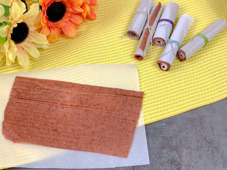 flat fruit roll up on a yellow placemat