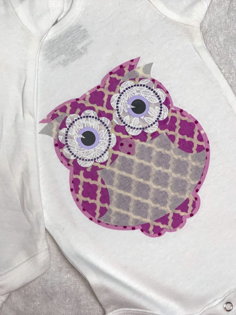 top view of owl fabric applique onsie