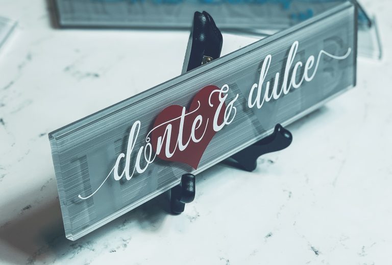 Gray glass tile decorated by cricut glass etching with red and white vinyl and a heart