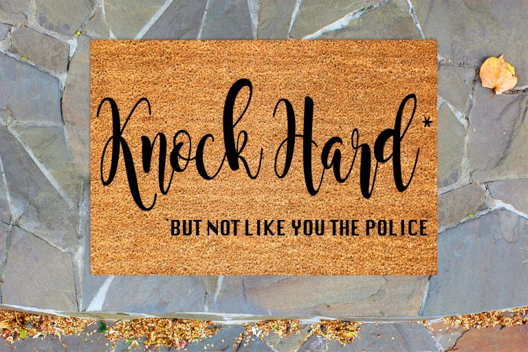 cricut stencil vinyl, stinceled coir doormat on the stone porch with autumn leaves.