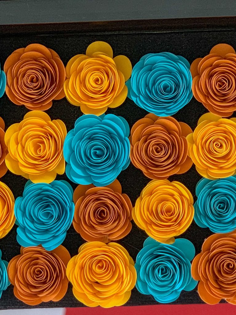 yellow orange and teal paper roses