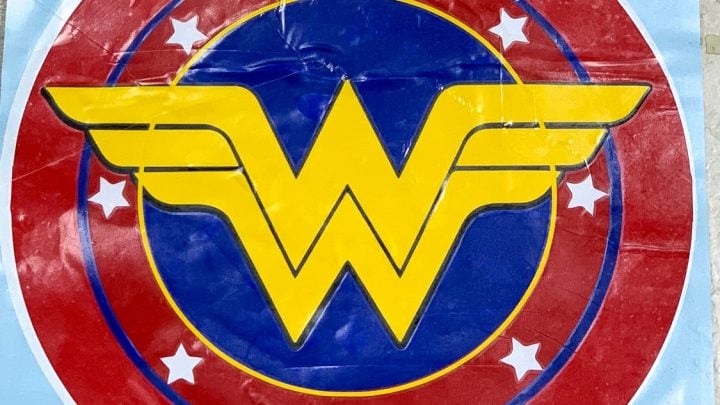 wall decal made from the red, white, blue and gold wonder woman logo