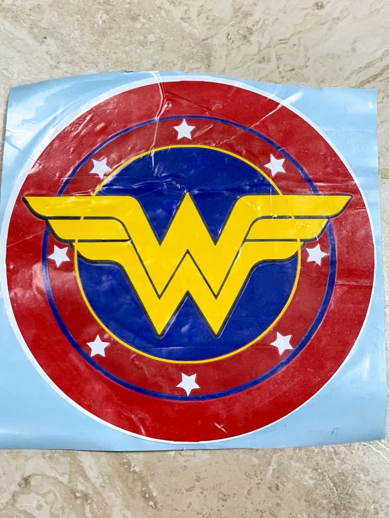 wall decal made from the red, white, blue and gold wonder woman logo