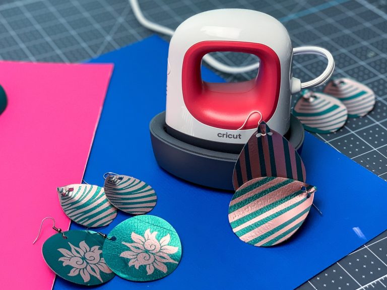 Cricut with several pairs of earring