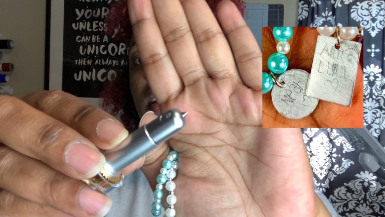 cricut engraving tip against a palm of hand