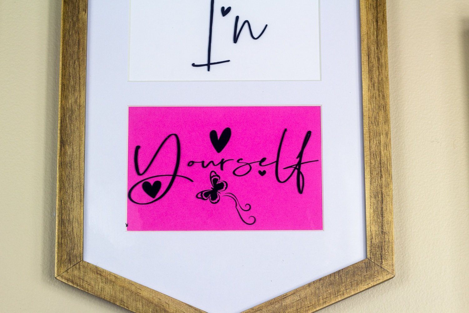 A framed sign with white background with in yourself in colorful text arrangement for a Cricut DIY wall art project. A framed sign with white background with in yourself in colorful text arrangement for a Cricut DIY wall art project.