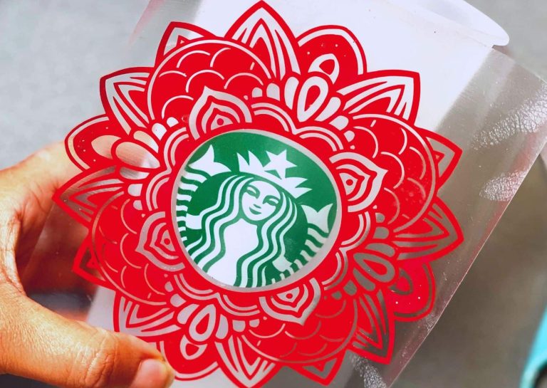 hand holding a custom starbycks cup with mandala svg