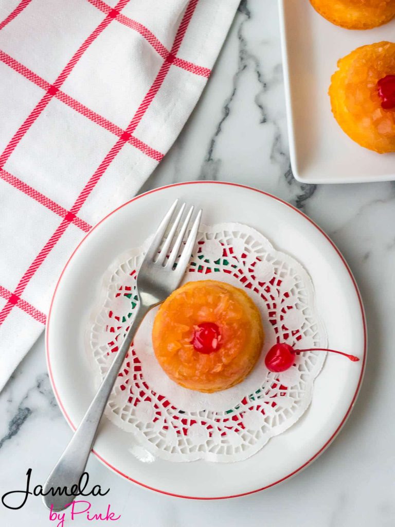 overhead view of mini pineapple upside down cake with cherry on top
