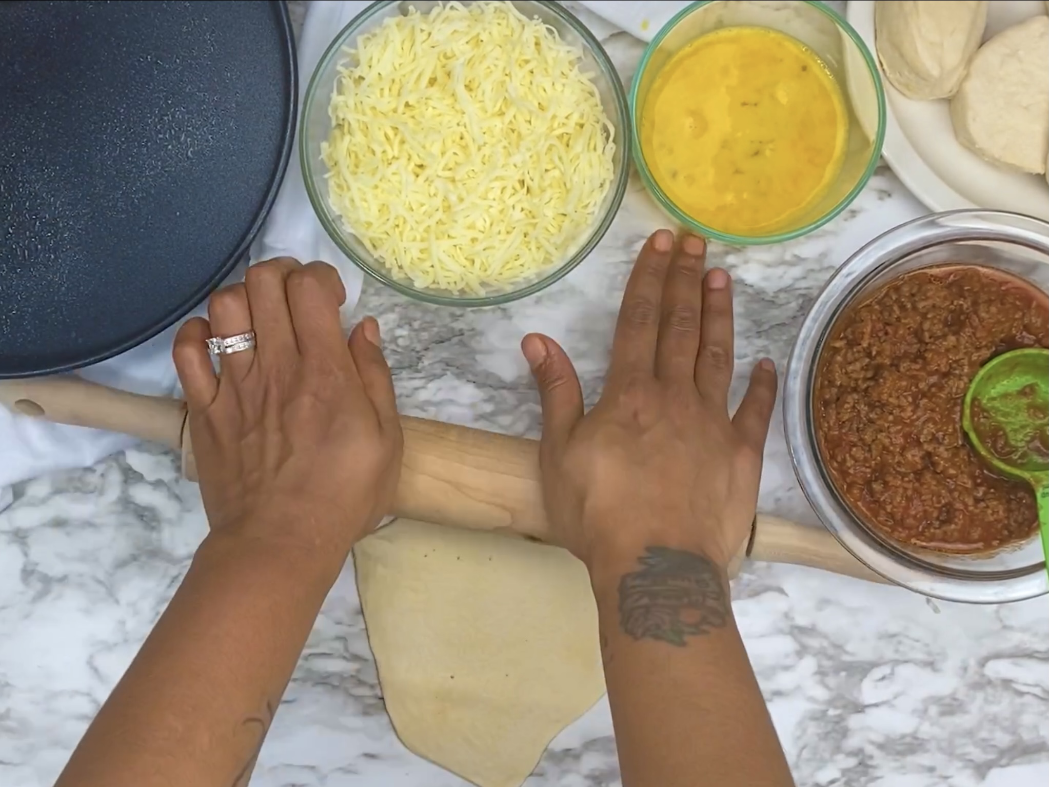 hands rolling out dough for sloppy joe bombs