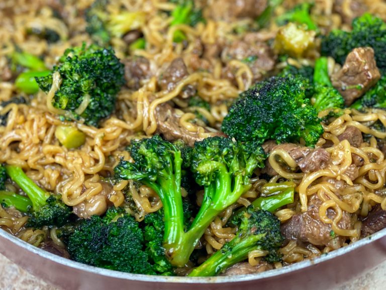 beef ramen stir fry with broccoli florets in bowl