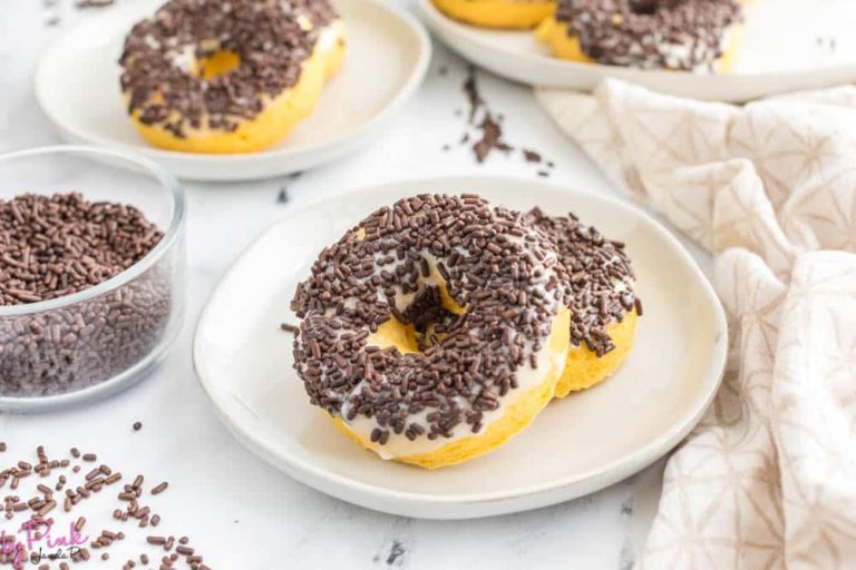 chocolate sprinkle covered cake mix donuts on a white plate